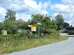 Åsbygda (Hekne) center, intersection of Andrew Furuseths veg, Storvegen, and Åsvege