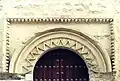 Side door decorated with pointed diamonds