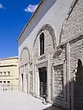 The main façade and traces of the porch