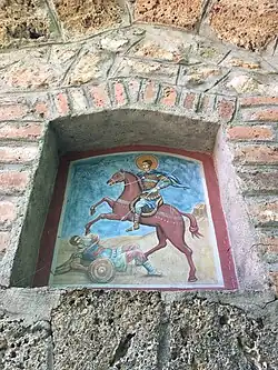 The saint's fresco above the chapel's entrance, 2018