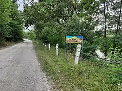 Welcome sign at the entrance of the village