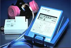 Small measuring device next to a respirator