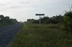 Entry sign on the Slavgorod-Znamenka-Yudikha road marking the beginning of the Siberian Giant settlement