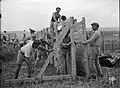 Construction of stockade wall, 1 April 1937