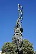 Close-up of the statue's representation of Avraham Adan, the man on the pole