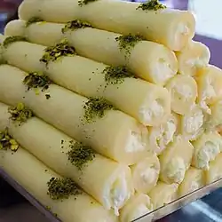 Levantine Halawet el jibn dessert; made of a semolina and cheese dough, filled with qishta.