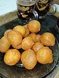 Lokma or awameh pieces are dipped in qatir. [22]