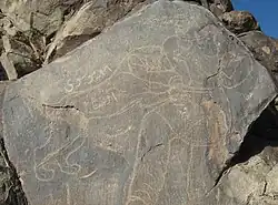 Inscription next to one of the petroglyphs of Kāl-i J̌angāl&nbsp;[fa], a gorge near Birjand.[note 1] Probably of early Sassanian date.[18]