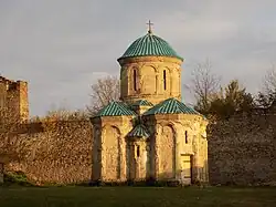 Church and fortified walls.