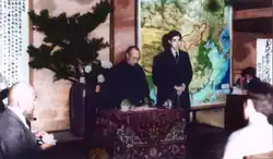 A lecture with a map of Mengjiang