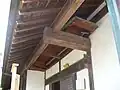An agebune (上げ舟) punt with a setting pole kept in the rafters of a wajū building in case of rising water