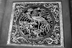 Image 58Relief of a fenghuang in Fuxi Temple (Tianshui). They are mythological birds of East Asia that reign over all other birds. (from Chinese culture)
