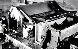 State of the damaged coffin, as photographed as part of the post-1938 looting investigations