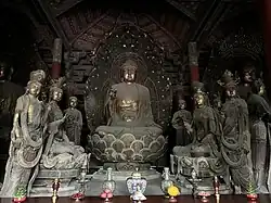 Liao dynasty statues of Shijiamouni flanked by multiple attendant Bodhisattvas and disciples