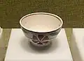 Japanese doucai-style bowl with floral design and tall foot ring, modern period.