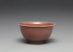 Red-glazed bowl with incised dragon decoration, Ming dynasty, Hongwu period (before 1398). National Palace Museum.