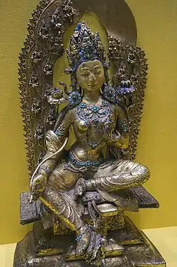 Green Tara c. 15th–16th century, copper with gilding, painted with clay and gold, held in the Tibet Museum.