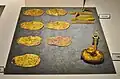 Dragon pattern ornament, heart leaf-shaped mirror plate bit, obi end fitting, excavated from Fujinoki Tomb