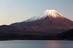 Photograph of Mount Fuji turned red by the rising sun