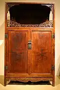 Huanghuali display cabinet (lianggegui) with openwork dragon (chilong) apron, Ming dynasty, 17th century.