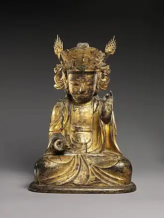 Seated bodhisattva (left attendant of a triad)