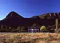 Part of Glen Davis, with a backdrop of the Wollemi National Park. The hotel is at the centre of the photograph.