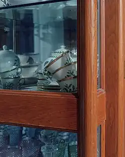 Cups in a cupboard.