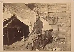 Photograph taken about 1862 of a contraband servant named John Henry in a Union Army Camp.[18]