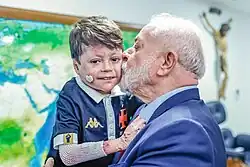 Brazilian president Luiz Inácio Lula da Silva with Menino Gui