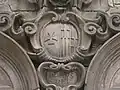 The arms of the hospital, on the chapel wall, carved by Pere Costa