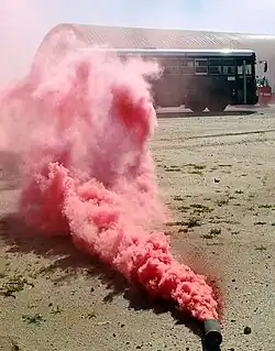 Smoke billowing from a red M18 at an Air National Guard base, Anchorage, Alaska, February 22, 2010.