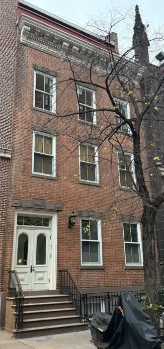 Facade of 11 West 11th Street as seen from beside it