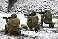 1st Battalion, 10th SFG (A) operators practice firing SOPMOD M4A1 carbine variants at the Panzer Range Complex.