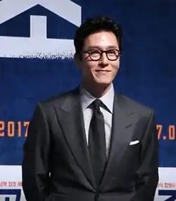 Kim Joo-hyuk wears black suit in an event