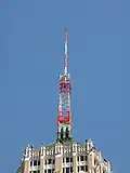An antenna tower 146 feet (45&nbsp;m) tall in San Antonio, TX with its red and white aircraft warning paint visible