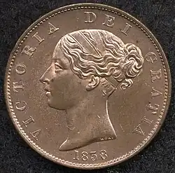 Copper coin with a woman's head facing left