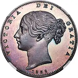 Silver coin with a woman's head facing left