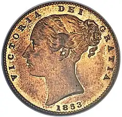 Copper coin with a woman's head facing left