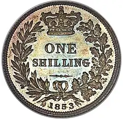 Silver coin with its value in a wreath