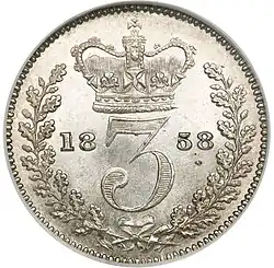 Silver coin with a number in a wreath