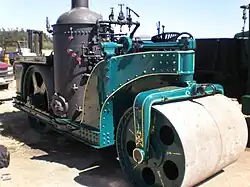 United States-built 1924 Buffalo Springfield steam roller: a vertical boiler design with tandem rolls. Note position of firebox door, facing out of frames.