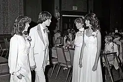 Image 2A couple at a prom in late 1970s: powder tuxedo and sleeved dress. (from 1970s in fashion)