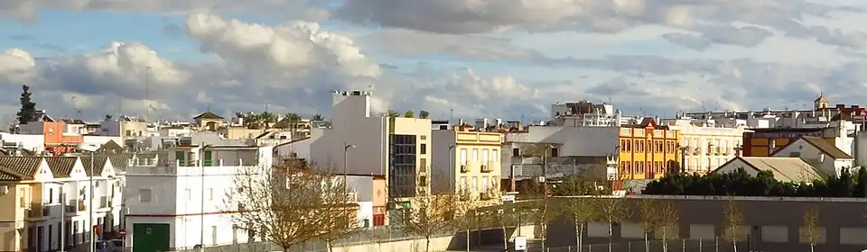 View of rows of two story buildings in Dos Hermanas