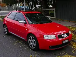 A medium-sized front-engined car with three doors