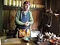 Medieval pharmacy with re-enactor