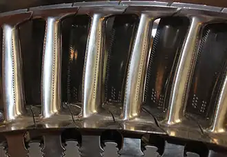 Turbine blades with sealing shroud at tip with knife edge fins which are part of the labyrinth sealing arrangement with open honeycomb shrouds on the turbine casing.[118] The platforms at the base of the airfoil stops hot gas leakage which would overheat the turbine discs.
