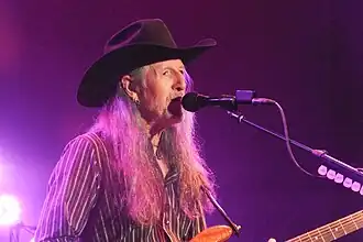 Simmons performing with the Doobie Brothers in 2013
