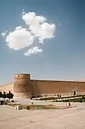 Exterior from the southeast, with children playing