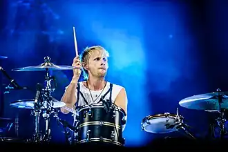 Howard performing with Muse in 2018