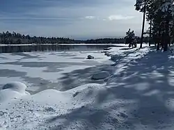Willow Springs Lake after a snowstorm, despite how it looks it is dangerous to attempt to walk on the ice.